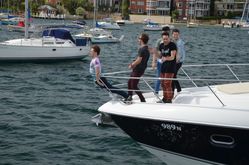 Posing as a figure head, the boys have some fun on the bow of the 5800 Sport Yacht © Stephen Milne